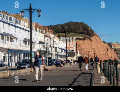 Sidmouth, Devon. 2nd Nov 2018. UK Weather: Visitors walk on the Esplanade at Sidmouth in bright sunshine. Photo Central/Alamy Live News Stock Photo