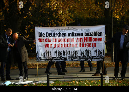 Warsaw, Poland, 2nd November 2018: Far right activists protest in demand on reperations for demages caused by German army at World War 2 during the official visit of German government to Poland. ©Madeleine Ratz/Alamy Live News Stock Photo