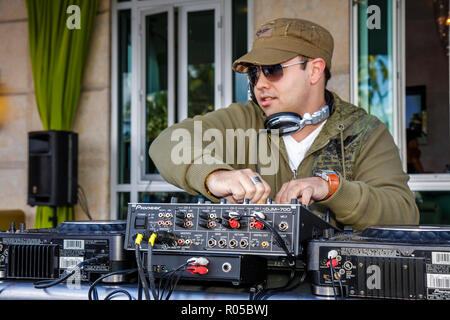 Miami Beach Florida,Ocean Drive,Art Deco Weekend,architecture festival Hispanic man men male adult adults,DJ,entertainment,Pioneer sound board,mixer,t Stock Photo