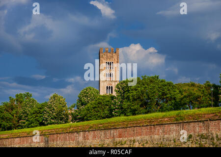 Lucca ancient walls public park with old tower and clouds Stock Photo