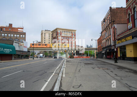 DETROIT, MICHIGAN, UNITED STATES - MAY 22nd, 2018: Detoit People Mover crosses a street in Greektown. The elevated monorail is one of many public modes of transportation in the city Stock Photo