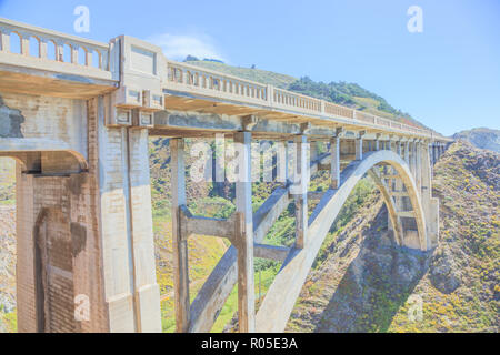 Iconic Bixby Bridge on Pacific Coast Highway Number 1 in California, United States.Bixby Bridge is located near Pfeiffer Canyon Bridge collapsed in Big Sur. American travel concept. Soft light. Stock Photo
