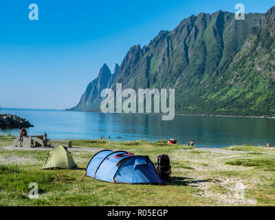 Beach Ersfjordstranden, fjord Ersfjord, public recreation area,  public camping, view to mountain range Okshornan,  island Senja, Troms, northern Norw Stock Photo