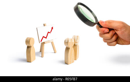 People gathered for a meeting and look at the speech of the leader. Meeting or report for the past period. Analytics and strategy planning. Profit and Stock Photo