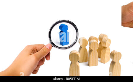 The leader from the rostrum speaks a speech addressing a crowd of people. Business concept of leader and leadership qualities, crowd management, polit Stock Photo