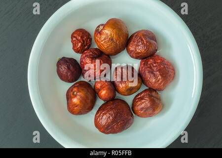 Bowl of dried jujube fruit (Ziziphus jujuba) Stock Photo