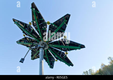 Solar Array, identified as 'Solar Photovoltaic Flair'  measuring 17 ft. diameter, weighing approx. 1200 lbs., Electric Vehicle Charge Station. Stock Photo