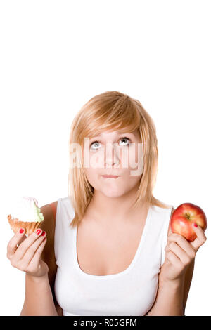 portrait of beautiful young woman with cake and apple isolated on white background Stock Photo