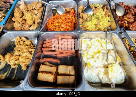 Assorted delicious fried street food, chicken, egg, fish cake, fish ball and soya cake at street market in Kota Kinabalu Sabah Malaysia. Stock Photo