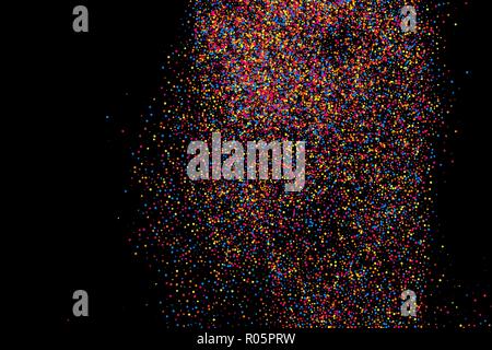 Colorful explosion of confetti. Grainy abstract  multicolored texture isolated on black background. Flat design element. Vector illustration,eps 10. Stock Vector