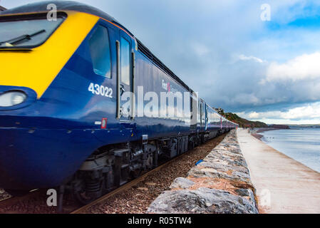 DAWLISH, DEVON, UK - 26OCT2018: GWR Class 43 High Speed Train 43022 travelling south along the sea wall at from Dawlish. Stock Photo