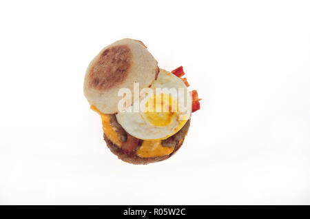 McDonalds new Triple Stack Egg mcmuffin w/2 sausage patties 2 bacon strips 2 slices american cheese on english muffin from above Stock Photo