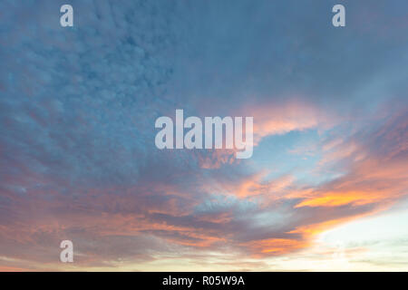 Dramatic colored sky. Moon and star in the clouds. Stock Photo
