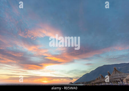 Dramatic colored sky. Moon and star in the clouds. Stock Photo