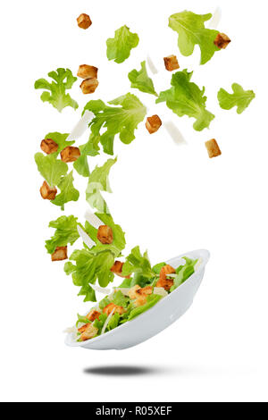 Lite salad flying on white Stock Photo