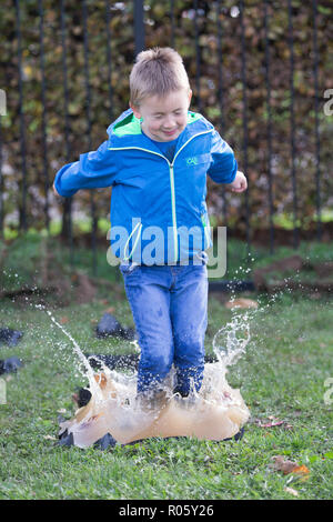 Picture dated October 23rd shows brother and sister Henry (7) and Lily Sales (9) getting in some early practice for the World Puddle Jumping Championships at Wicksteed Park in Kettering,Northants, which is being held tomorrow.(Wed)  Competitors have been busy training for the sixth annual World Puddle Jumping Championships tomorrow (Wed).  Contestants have been practising their splashing as they prepare for the event at Wicksteed Park in Kettering.  Organisers have made more puddles than ever before in an attempt to make this year's competition the biggest and best yet. Stock Photo