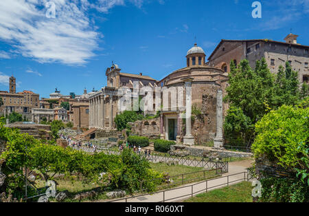 Via Sacra at the Roman Forum with view of Temple of Romulus (Santi Cosma e Damiano) and Temple of Antonius and Faustina (San Lorenzo in Miranda), Rome Stock Photo