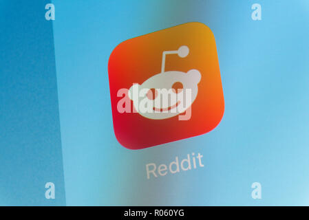 Reddit App on cellphone screen Stock Photo