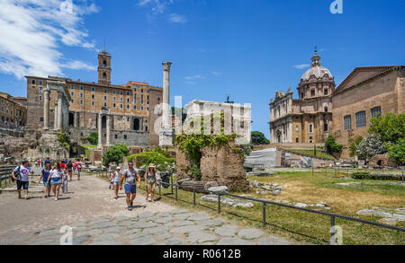 Roman Forum of the ancient city of Rome, from left to right: the ruins of the Temple of Saturn, the Column of Phocas, in the background the Church of  Stock Photo