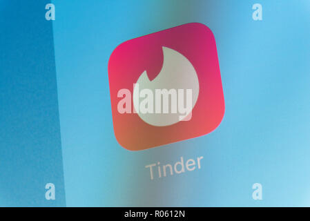 Mobile Dating App Tinder Logo Is Seen On An Android Mobile Device With A Figure Of Hacker In The Background Stock Photo Alamy