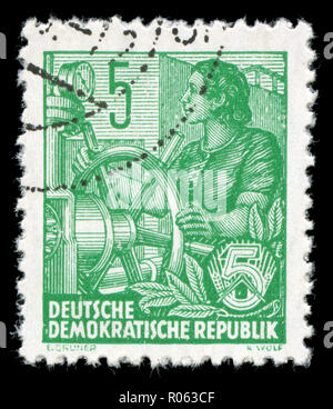 Postmarked stamp from the East Germany in the Five-year Plan series