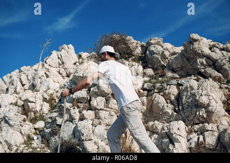 A young man is engaged in hiking Stock Photo