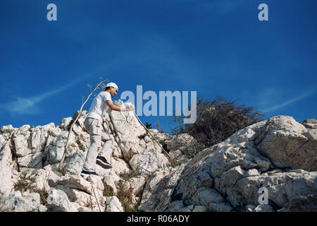 A young man is engaged in hiking Stock Photo