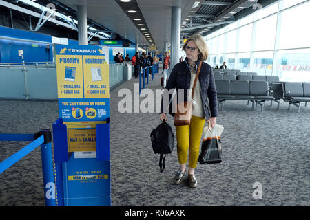 Pic shows: New tiny bag size allowed on Ryanair planes for free.  Checking sizer at all the gates to stop passengers see here at Stansted Airport.   P Stock Photo