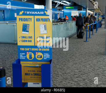 Pic shows: New tiny bag size allowed on Ryanair planes for free.  Checking sizer at all the gates to stop passengers see here at Stansted Airport.   P Stock Photo