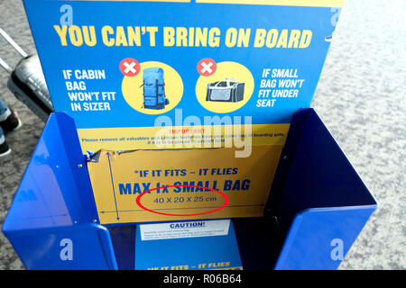 Pic shows: New tiny bag allowed on Ryanair planes for free. Checking sizer at all the gates to stop passengers see here at Stansted Airport. P Stock Photo - Alamy