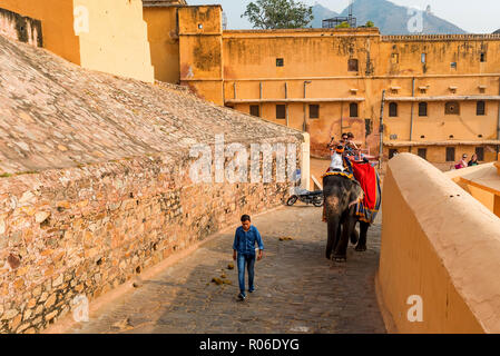 AMBER, INDIA - 5 NOVEMBER 2017: Unidentified people ride elephants to Amber Fort Stock Photo