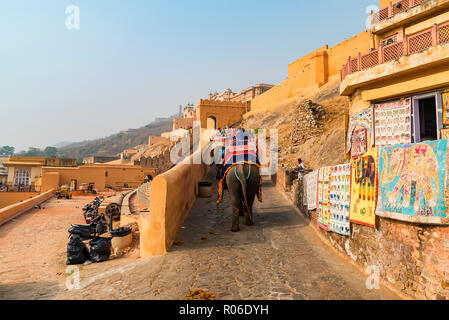 AMBER, INDIA - 5 NOVEMBER 2017: Unidentified people ride elephants to Amber Fort Stock Photo