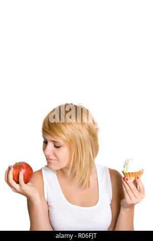 portrait of beautiful young woman with cake and apple isolated on white background Stock Photo