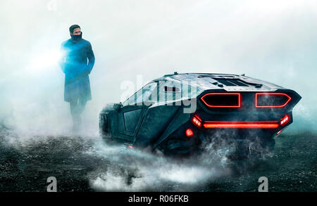 'K' (Ryan Gosling) besides his Spinner, publicity still from Blade Runner 2049 (2017) directed by Denis Villeneuve. A sequel to the 1982 classic set thirty years later where a new blade runner uncovers a secret. Stock Photo