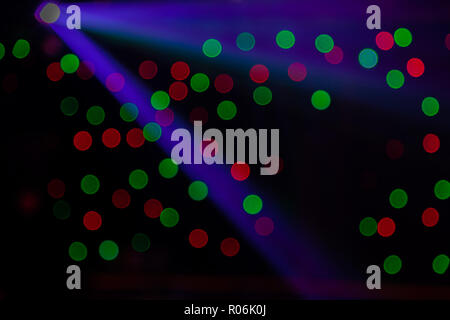 Red and green bokeh colors from nightclub in Australia on black background Stock Photo