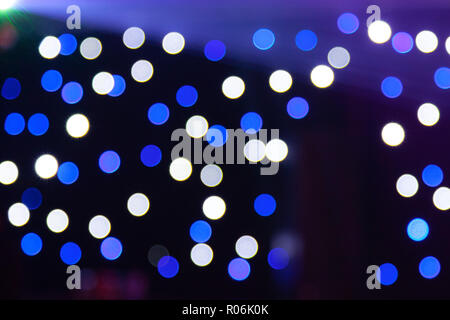 Blue and white bokeh colors from a nightclub in Australia on black background Stock Photo
