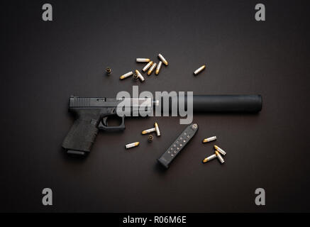 Semiautomatic pistol with silencer and live ammunition. Stock Photo