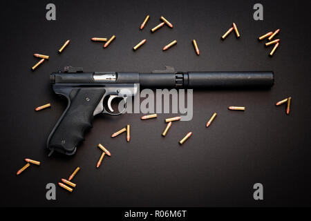 Semiautomatic pistol with silencer and live ammunition. Stock Photo