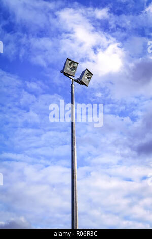 Modern spotlight on the sports field against the sky Stock Photo