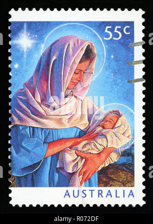 AUSTRALIA - CIRCA 2011: A canceled postage stamp from Australia, shows the illustration of Mary and the baby Jesus, commemorating Christmas, circa 201 Stock Photo