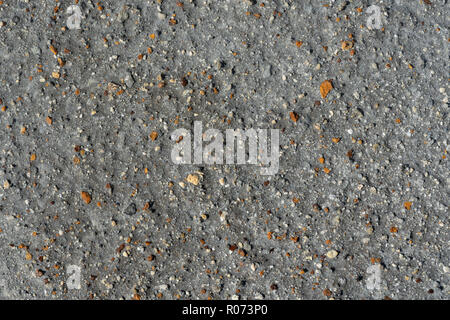 Closeup macro view of gray volcanic sand and small colorful stone surface. Detailed natural background or texture taken in natural environment in crat Stock Photo