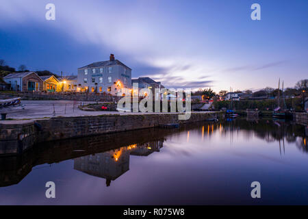 Dusk Settles Over the Famous Pier House in Cornwalls Charelstown Harbour. The historic harbour of Charlestown is a popular filming location both natio Stock Photo