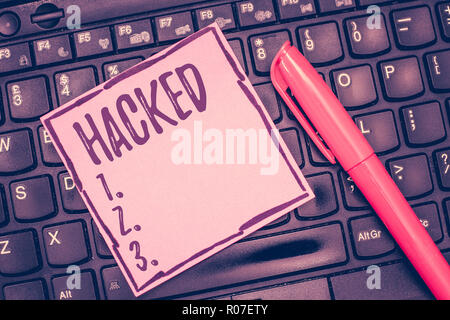 Word writing text Hacked. Business concept for Gain unauthorized access to data in system or computer Cyber crime. Stock Photo