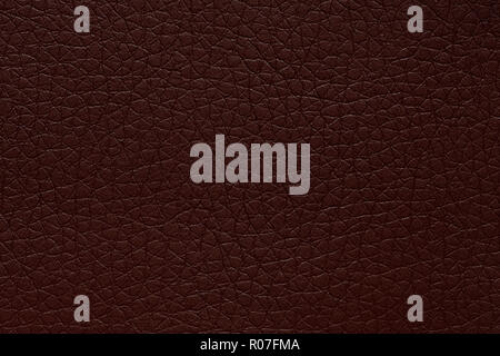 Deep leather texture in exciting colour. Dark brown leather background. Stock Photo