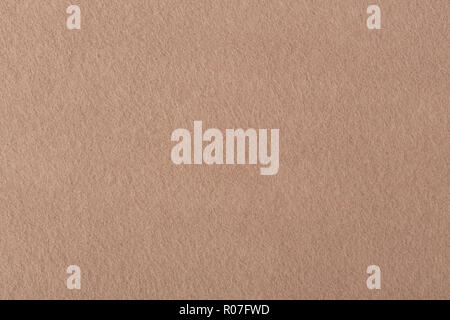 Natural light brown felt texture. Light beige felt background. Stock Photo