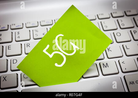 Handwriting text 5G. Concept meaning Next generation of mobile networks after the 4G LTE Fast speed connection. Stock Photo