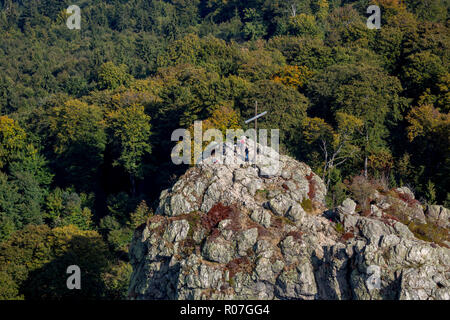 Aerial view, Bruchhauser stones, mountaineer with binoculars, summit cross on the hill Feldstein, Bruchhausen, recreation area, low mountain range, Ol Stock Photo