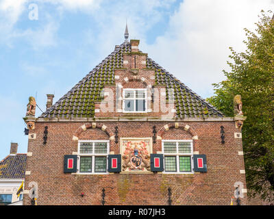 Top facade of old weigh house in city centre of Workum, Friesland, Netherlands Stock Photo