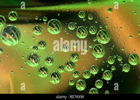 Green and yellow bubbles in plastic bottle
