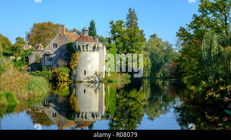 Autumn colours and sunshine on the old castle in the grounds of Scotney, East Sussex, UK Stock Photo